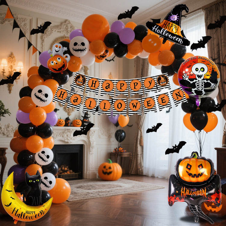a halloween balloon arch with a banner and bats