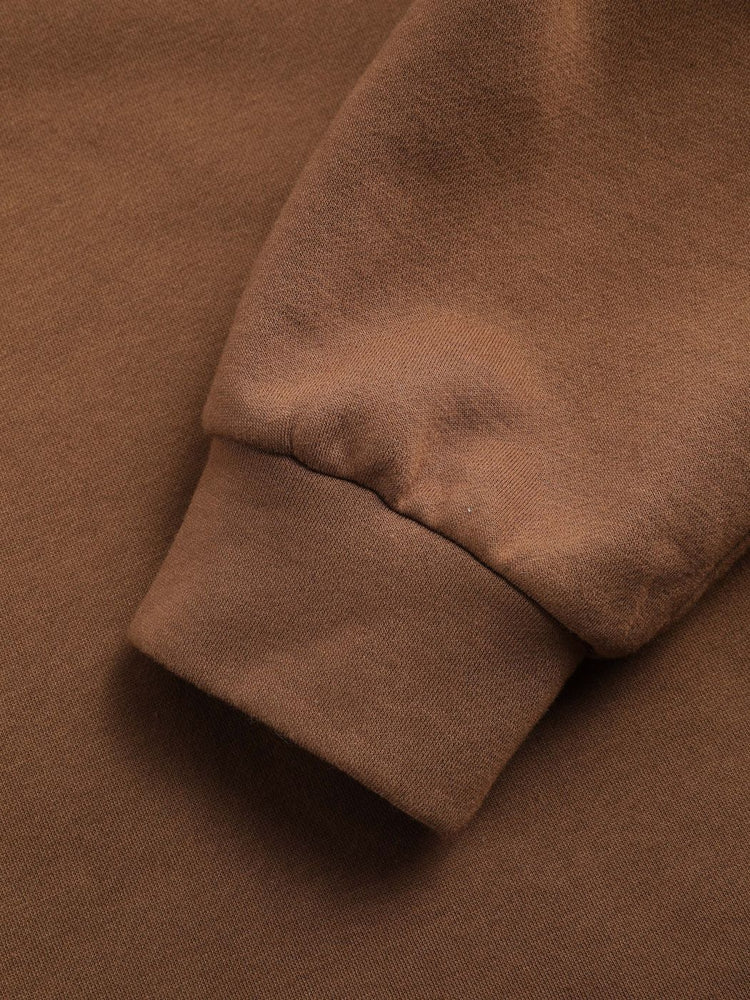 a brown sweater sleeve
