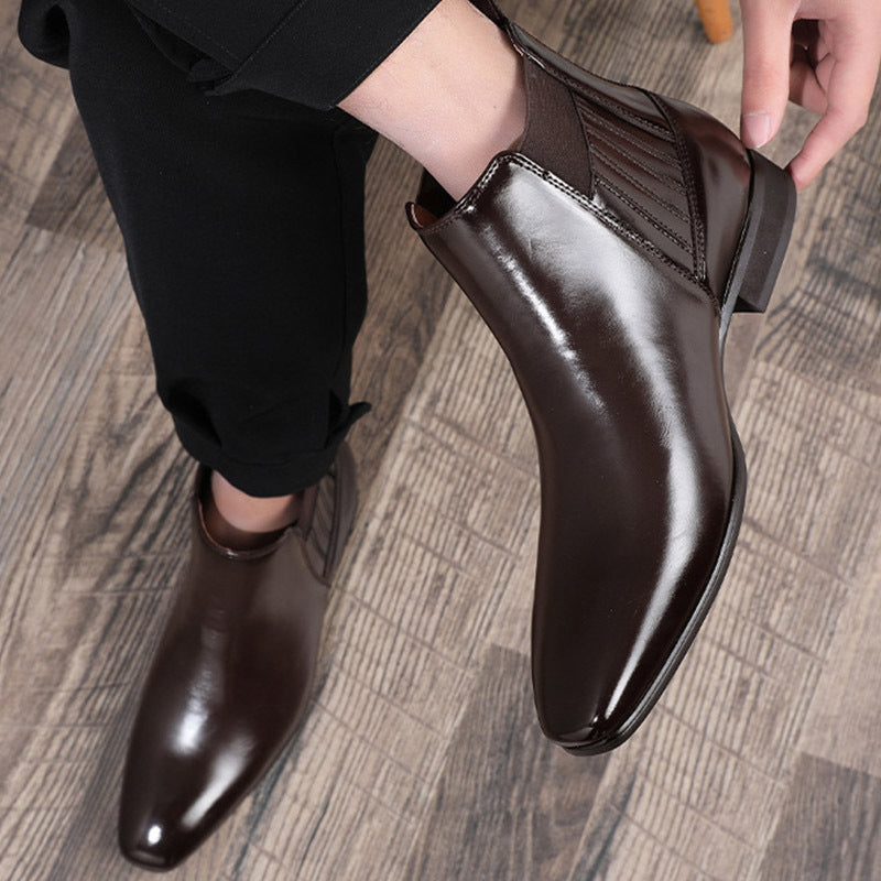 a person holding a brown shoe