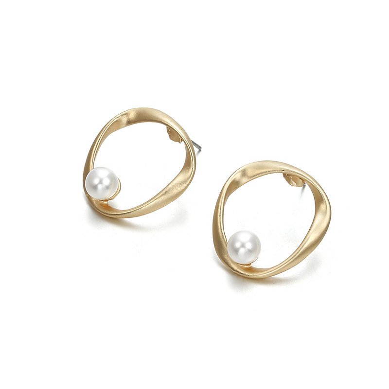 a pair of gold earrings with pearls