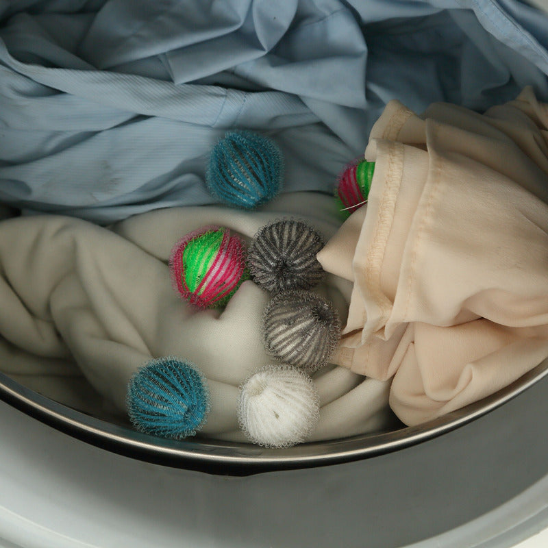 a bowl of clothes and balls