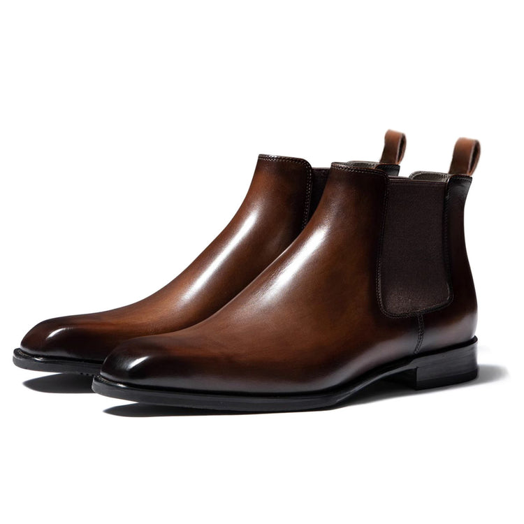 a pair of brown leather boots