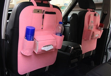 a pink car seat with a pocket
