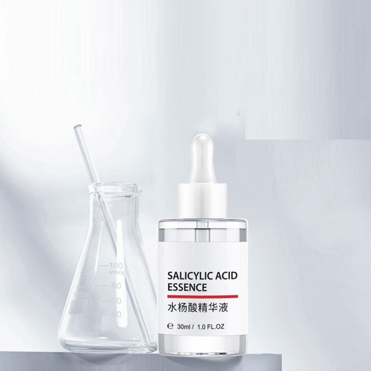 a bottle of salicylic acid essence and a beaker