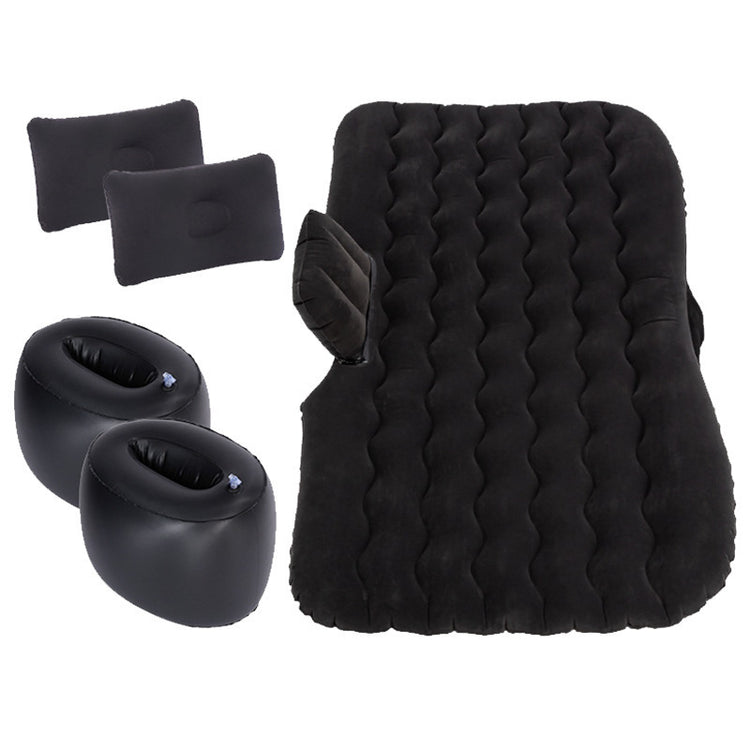 a black air mattress and pillows