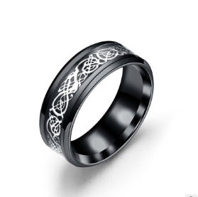 a black ring with a silver design