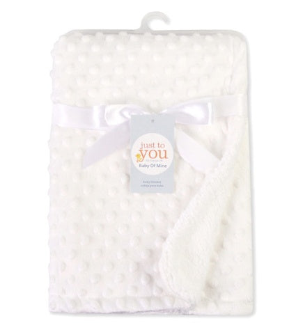 a white blanket with a bow