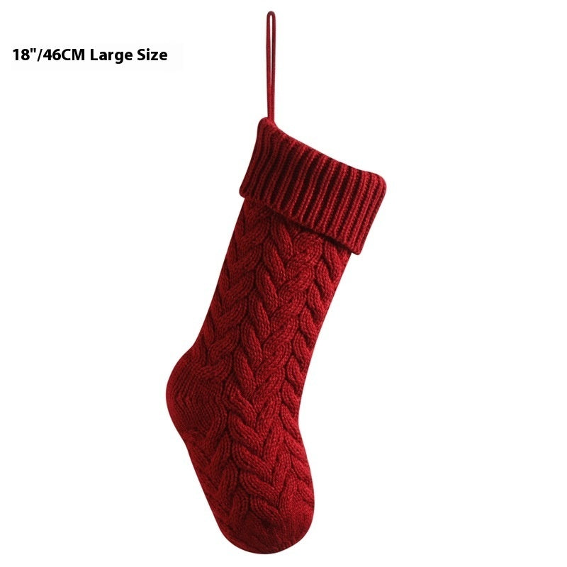 a red knitted stocking from a string