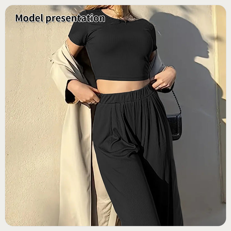a woman wearing a black shirt and pants