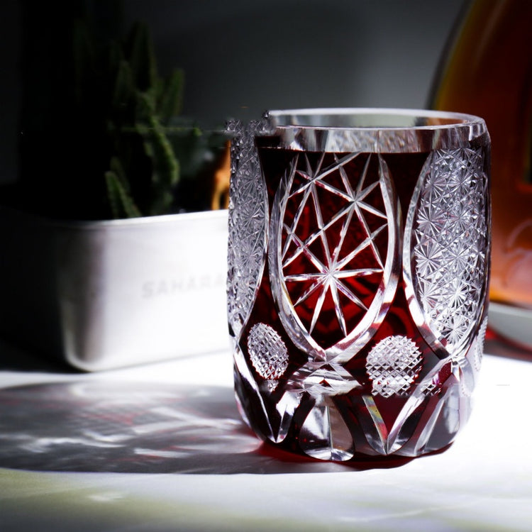 a glass with red liquid in it