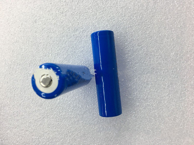 a blue battery on a white surface