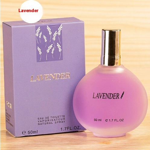 a bottle of perfume next to a box