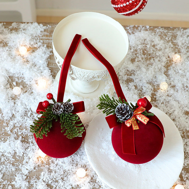 two red ornaments on a table