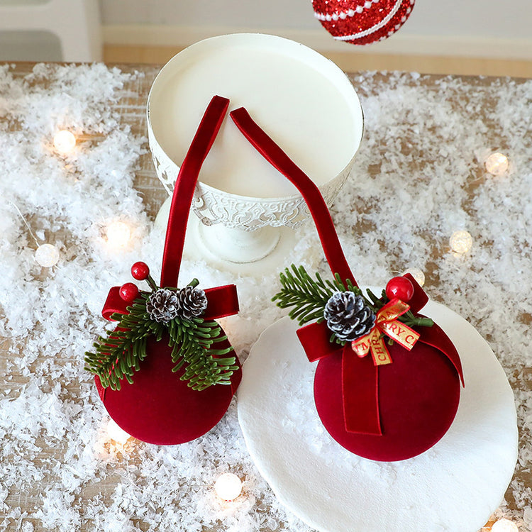 two red ornaments on a table