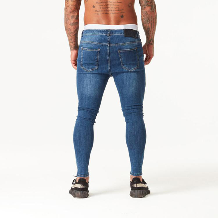 a man wearing jeans and sneakers