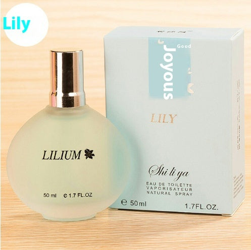 a bottle of perfume next to a box