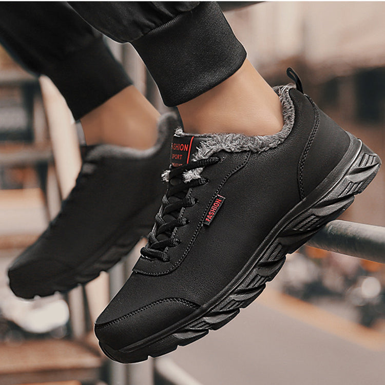 a person's feet in black shoes