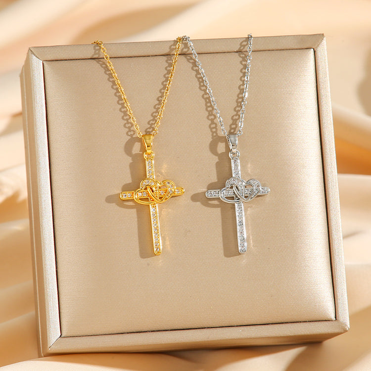 a pair of gold and silver cross necklaces