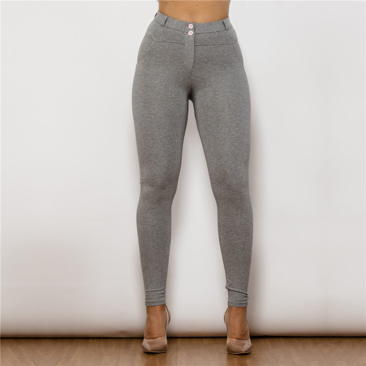 a woman wearing grey pants