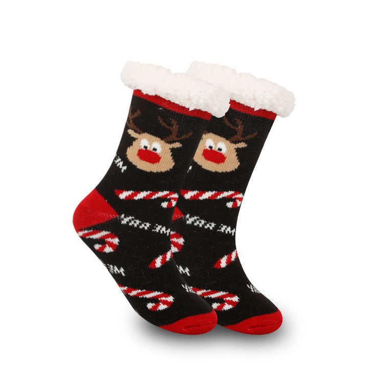 a pair of socks with reindeer and candy canes