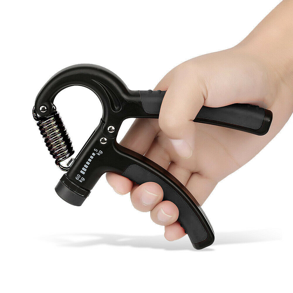 a hand holding a black hand gripper