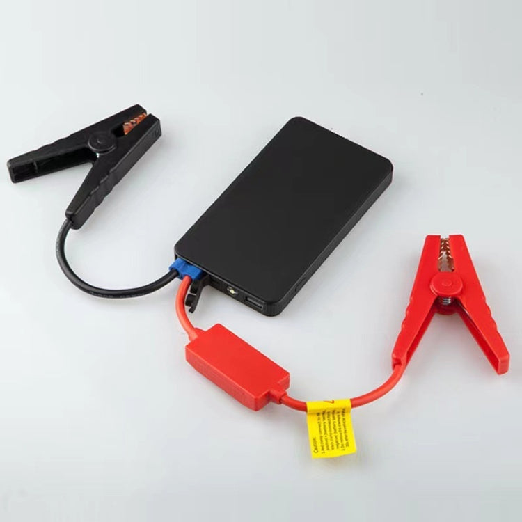 a battery charging device with red and black cables