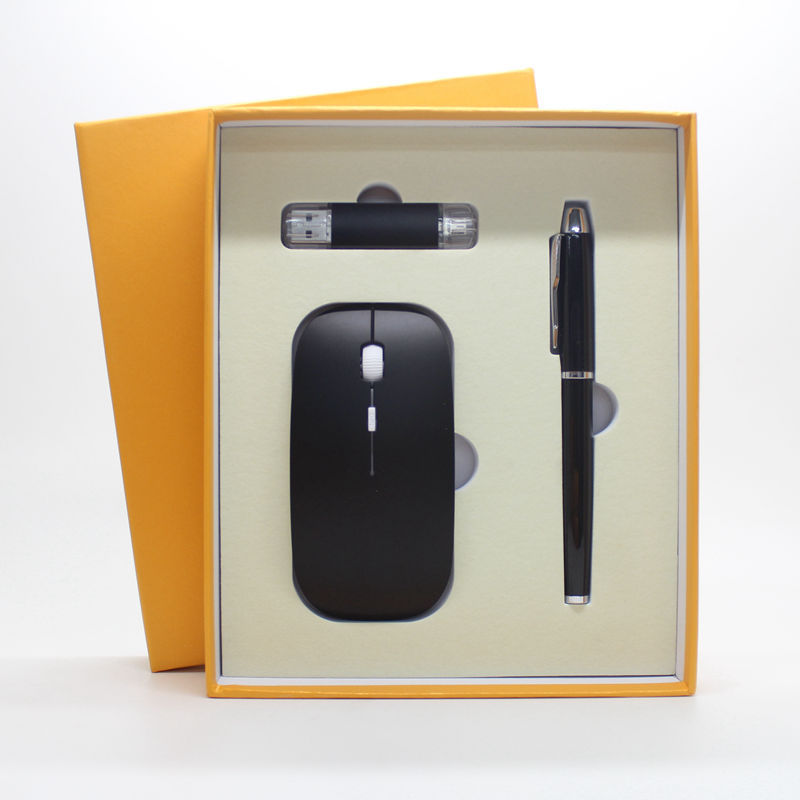 a black computer mouse and pen in a box