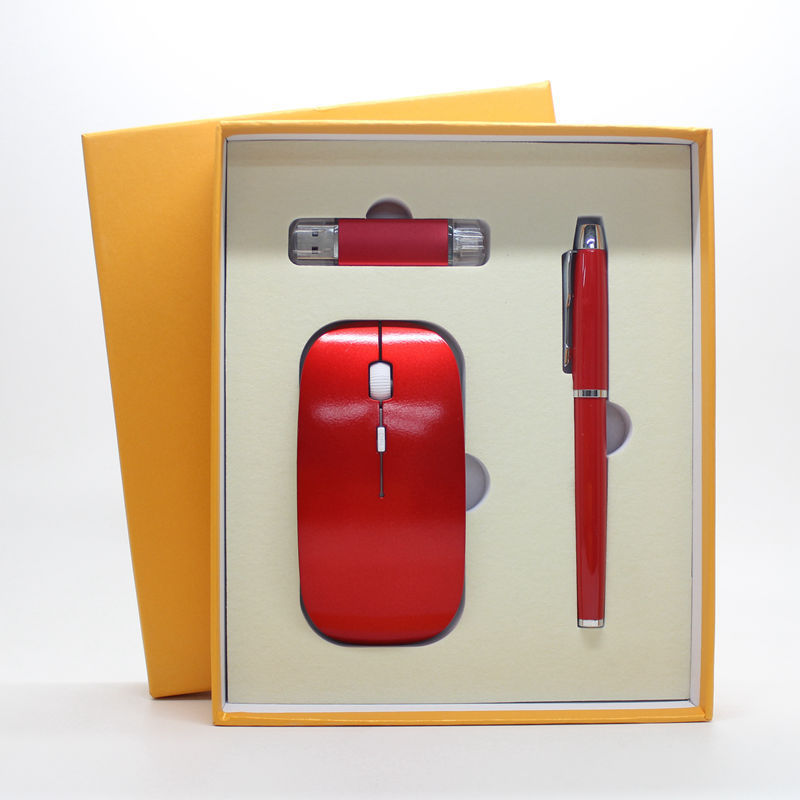 a red computer mouse and pen in a box