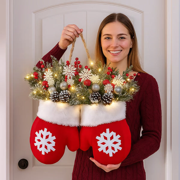 a woman holding a christmas decoration