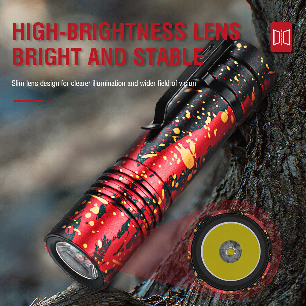 a red and black flashlight on a tree