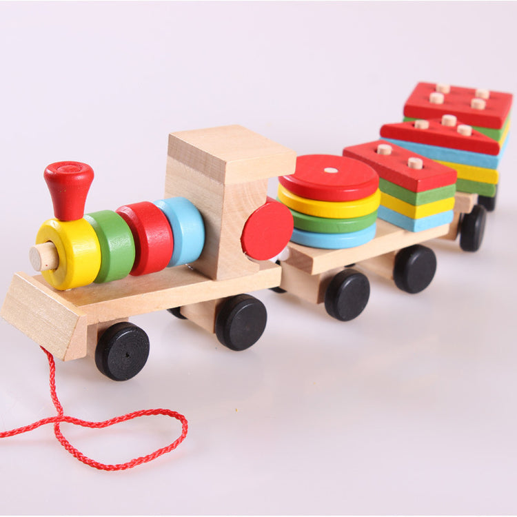 a wooden toy train with colorful blocks