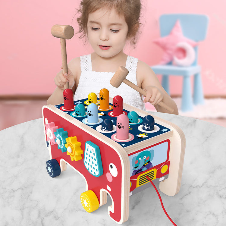 a girl playing with a toy