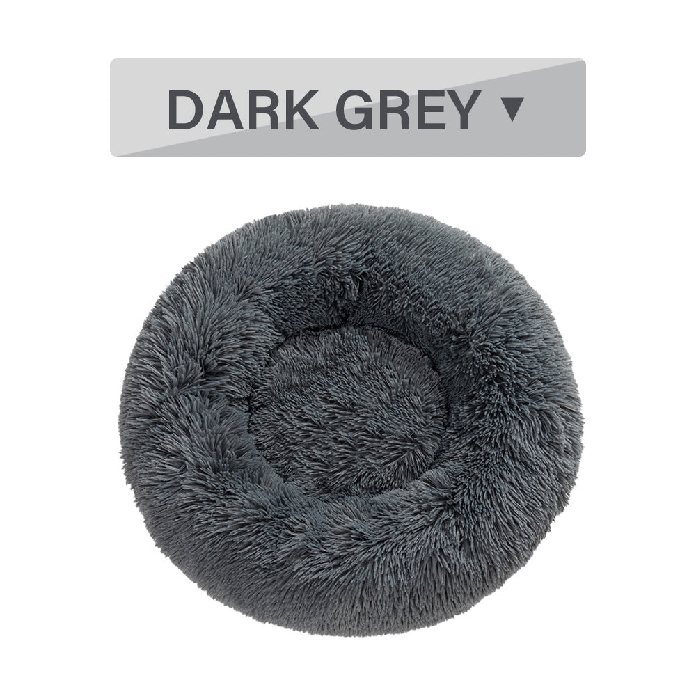 a grey furry dog bed