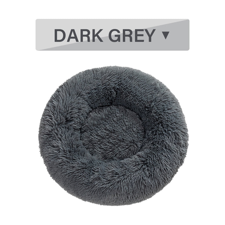 a grey furry dog bed