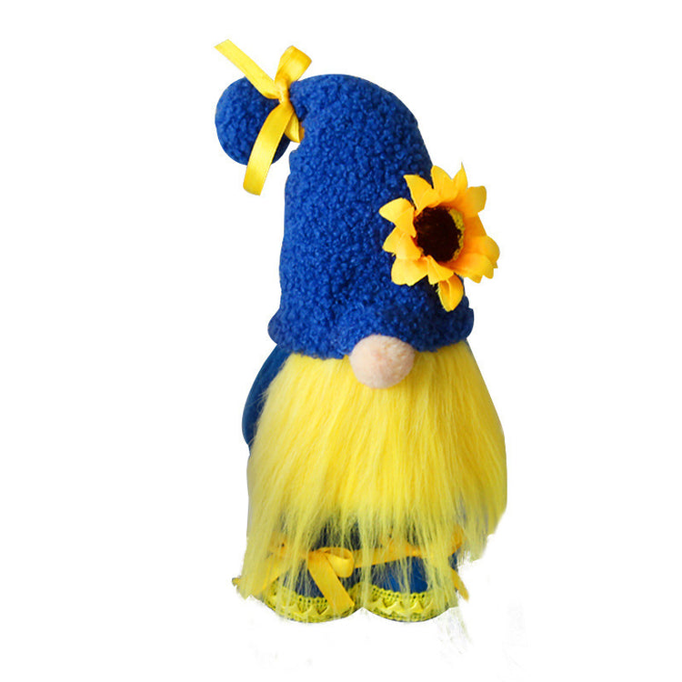 a blue and yellow stuffed gnome