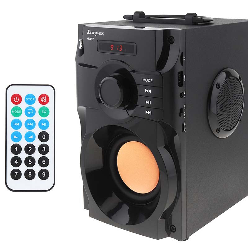 a black speaker with a remote control