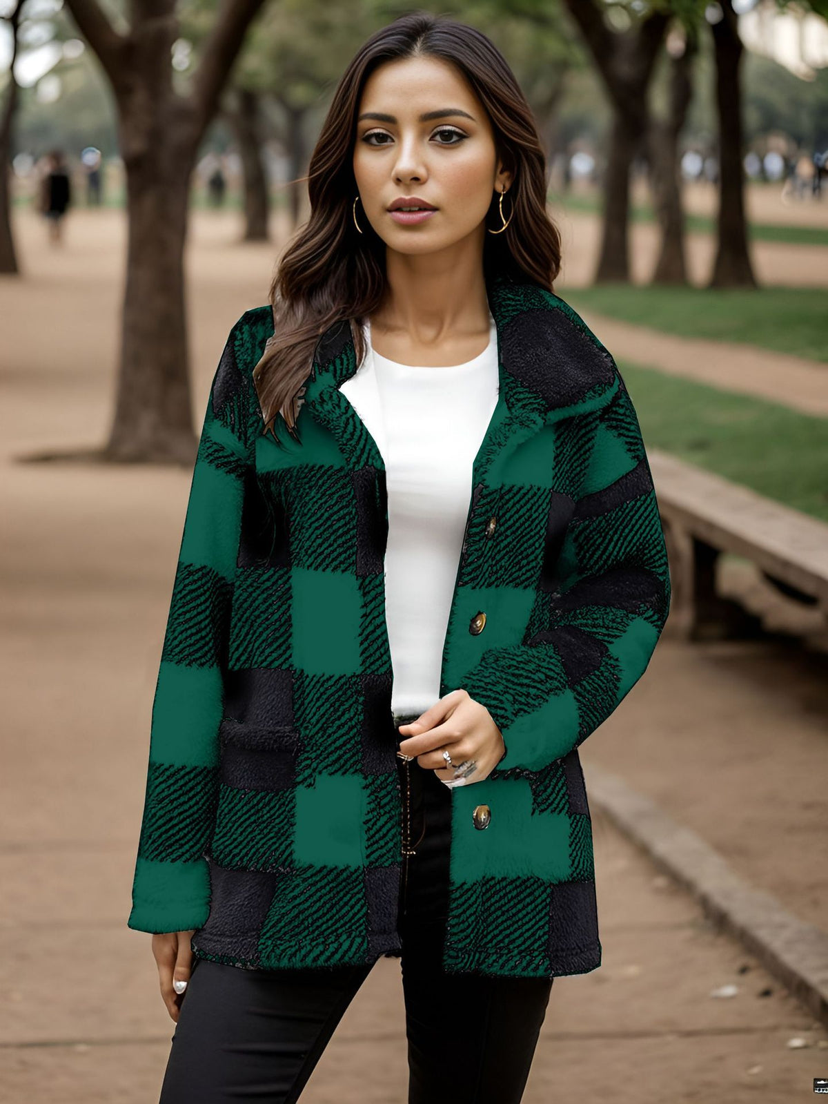 a woman standing outside in a park