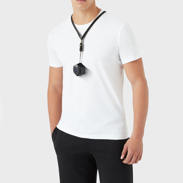 a man wearing a white shirt and a black necklace