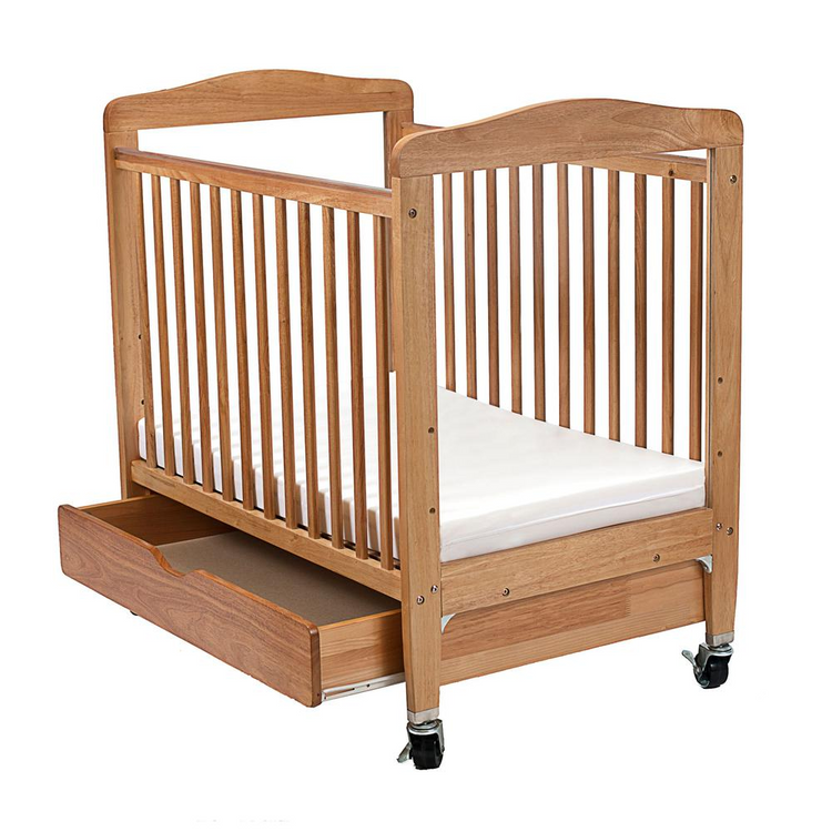 a wooden crib with a drawer