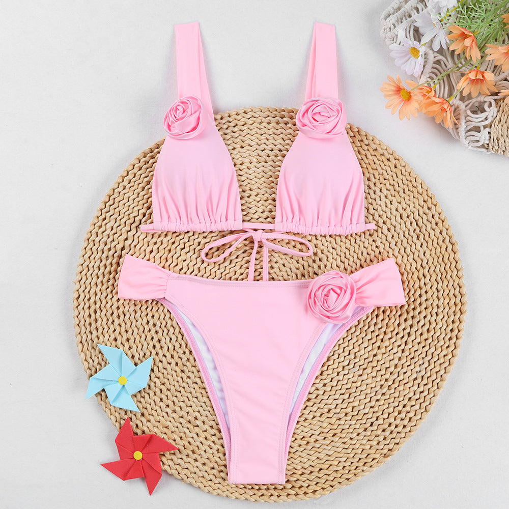 a pink garment on a straw mat