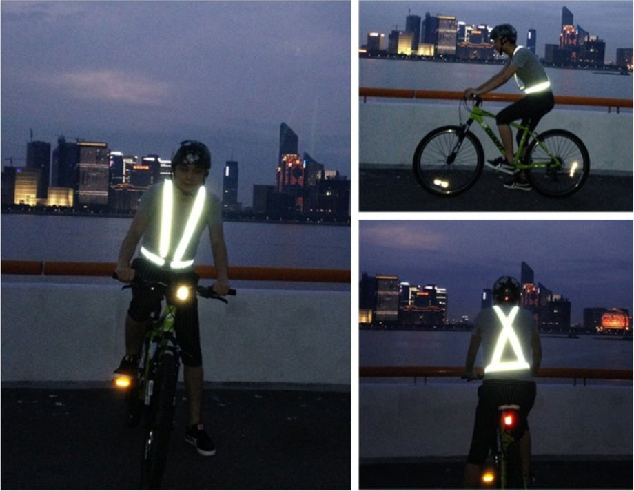 a man wearing a reflective vest on a bicycle