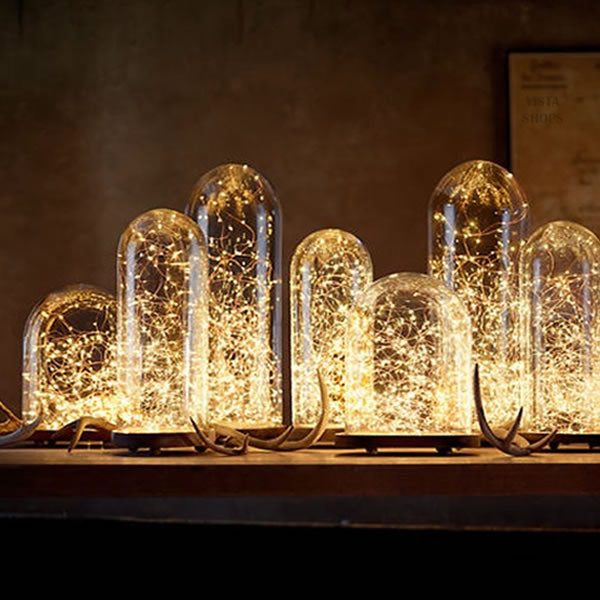 a group of glass domes with lights