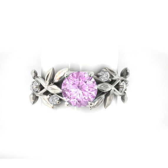 a ring with a pink stone