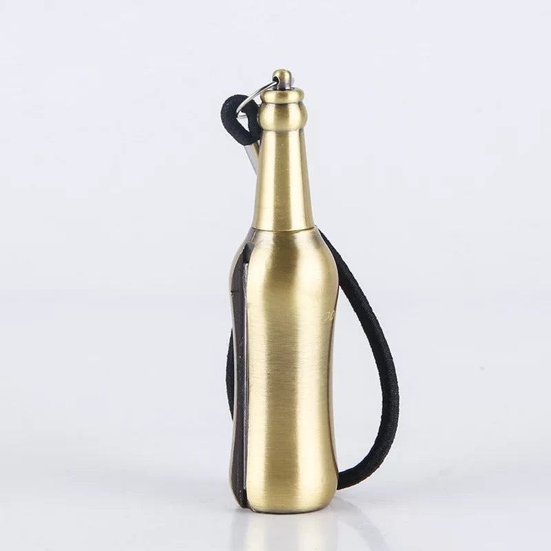 a gold bottle with a black strap