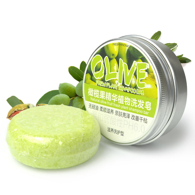 a round green soap with a round container next to a green plant