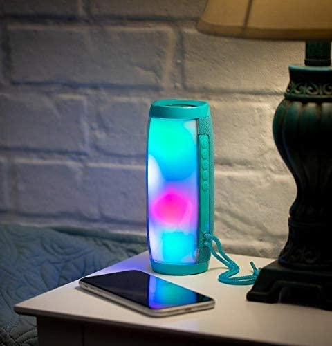 a bluetooth speaker with a colorful light on top of a table