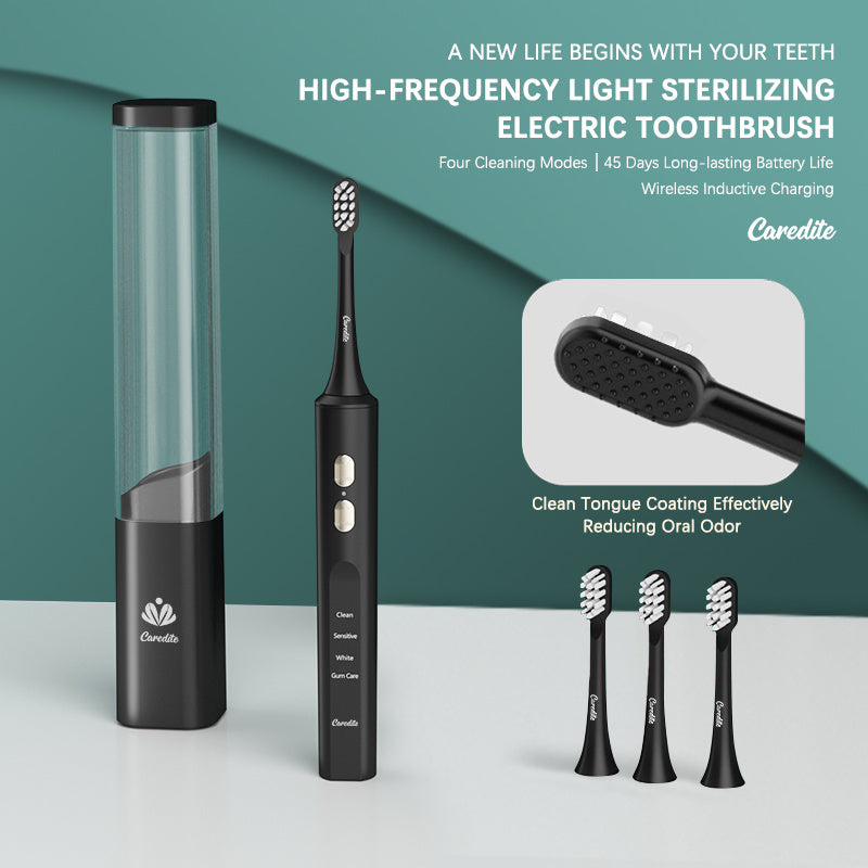 a black electric toothbrush and a tube