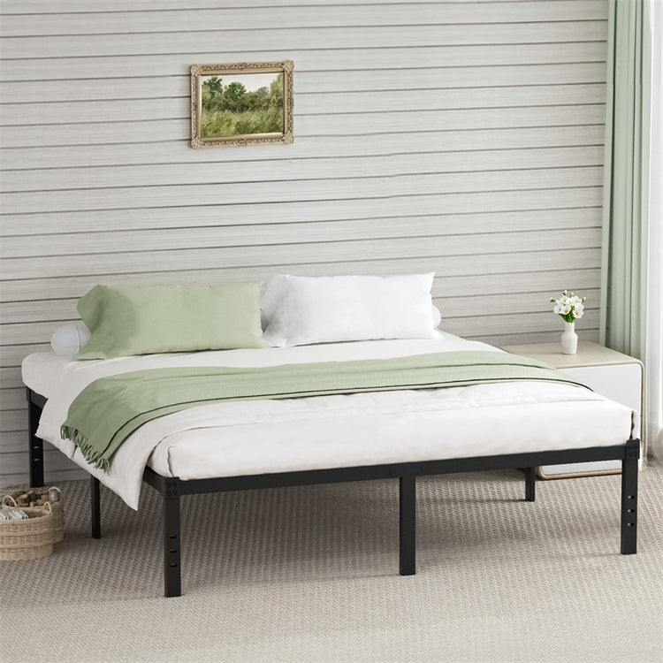 a bed with green and white sheets