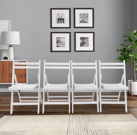 a row of white chairs in a room