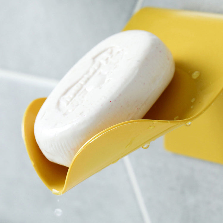 a soap bar in a yellow holder